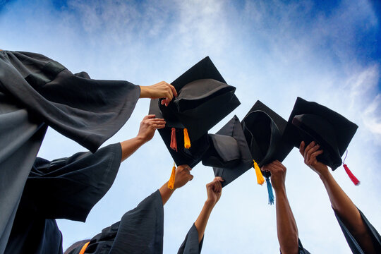Graduation Caps Thrown in the Air success graduates of the university,Concept education congratulation graduates in University.
