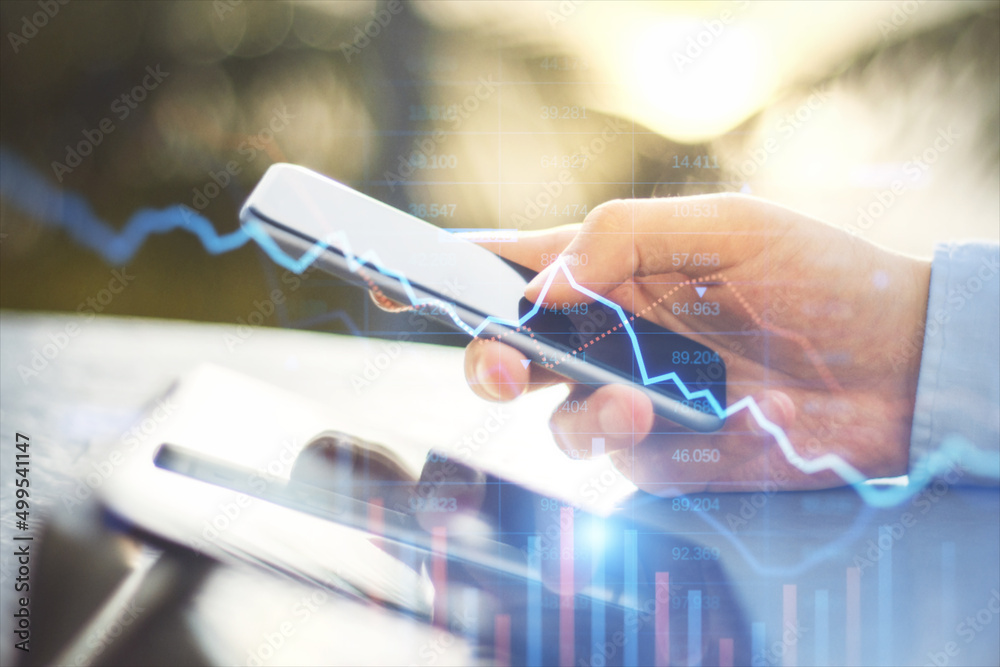 Aufkleber close up of hand using smartphone with falling downword forex chart on blurry outside background. cr