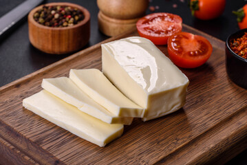 Image of a bar and grated mozzarella cheese on a dark background