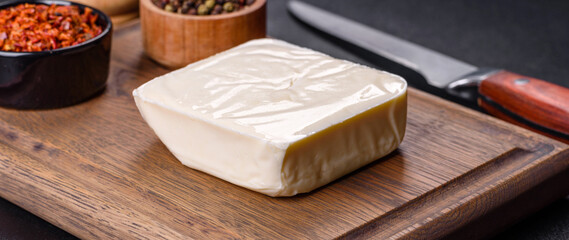 Image of a bar and grated mozzarella cheese on a dark background