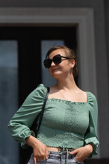 Portrait of a woman in sunglasses in summer