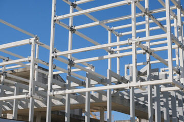 steel scaffolding for new building construction. architecture framework concept and engineering equipment