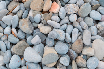 pebbles on the beach. outdoor natural surface in sunset golden hour