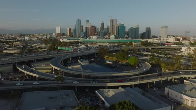 flying over freeways towards downtown LA skyline
