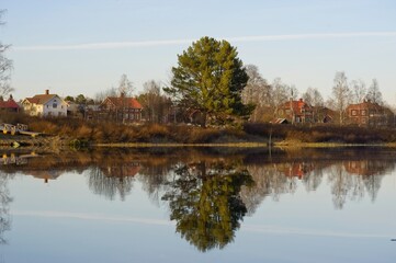 Scenes of a river running through forests and the small town of Björbo in Dalarna.