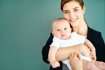 Being a mother and successful businesswoman is so rewarding. Studio shot of a successful young...