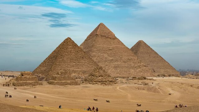 Daily life in Giza complex or necropolis with main pyramids (Great of Giza, of Khafre, of Menkaure), subsidiary ones, remains. Timelapse. Tourists see landmarks of ancient Egypt on horseback, camels
