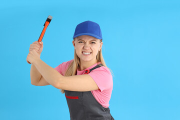 Concept of occupation, young woman on blue background