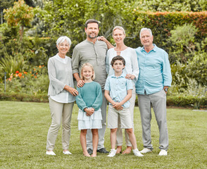 Fototapeta premium How lucky we are to have each other. Shot of a multi-generational family standing together outside.