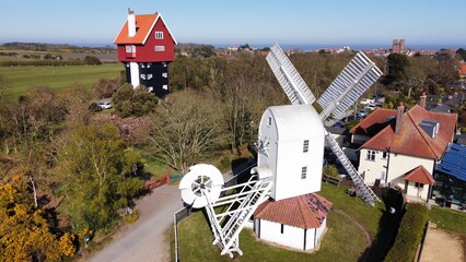Aerial view Windmill and House in the clouds thorpeness Suffolk England 