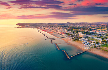 Attractive summer view from flying drone of Cattolica town, Province of Rimini. Captivating sunrise...