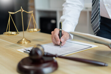 Law consultancy concept A male lawyer making clear of some details by adding clearer description on...