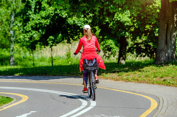 Fototapeta premium Cyclist ride on the bike path in the city Park 