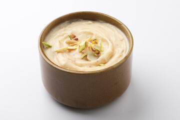Shrikhand is an Indian sweet dish made of strained curd,garnished with dry fruits and saffron....