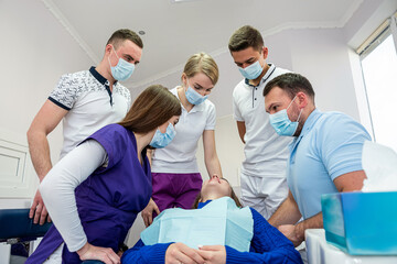 group of caucasian dentists and assistants at medical office