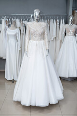 boutique wedding dress on mannequin in bridal store