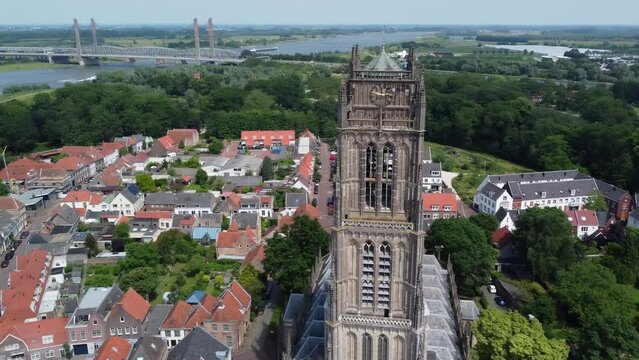 Aerial bird view footage of the Saint Martin church in Zaltbommel is a municipality and a city in the Netherlands in the background showing Waal river a branch of the river Rhine 4k high resolution