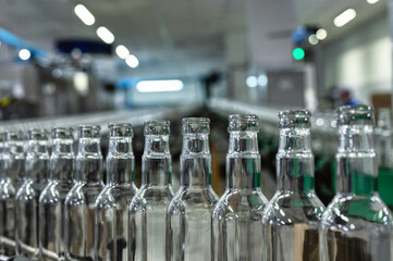 Row of glass bottles to fill with expensive alcohol drinks