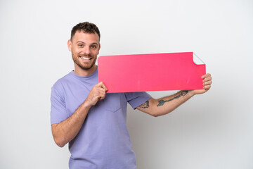 Young Brazilian man isolated on white background holding an empty placard