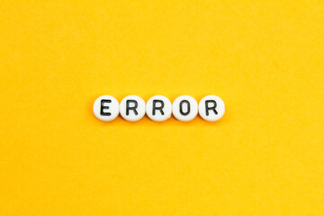 letters in a white circle with the word error and an orange background