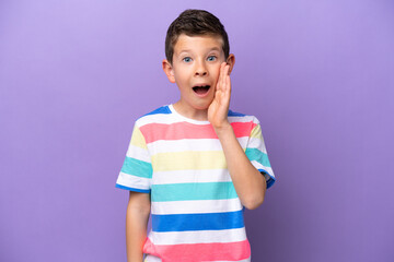 Little boy isolated on purple background with surprise and shocked facial expression
