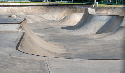 Public playground for a skateboard in a recreation park.