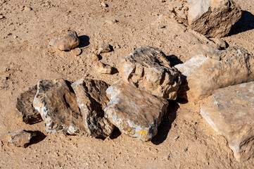 stacked together stones of different sizes and shapes in the desert.