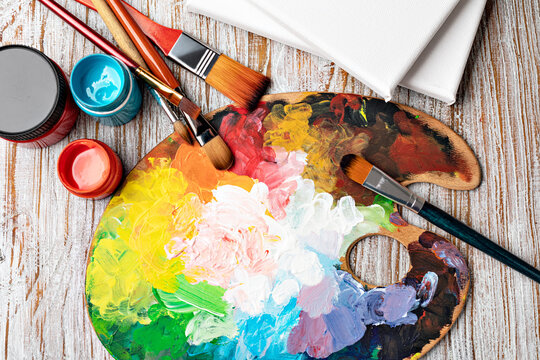 art palette with colorful mixed paints