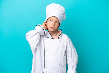 Little chef boy isolated on blue background having doubts