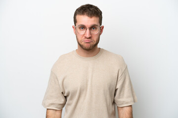 Fototapeta premium Young caucasian man isolated on white background with sad expression