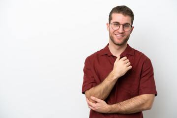 Young caucasian man isolated on white background laughing