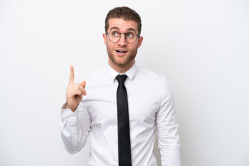 Young business caucasian man isolated on white background thinking an idea pointing the finger up