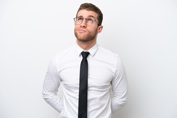 Young business caucasian man isolated on white background and looking up