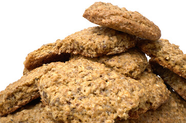 Homemade oatmeal cookies in a pile isolated against white