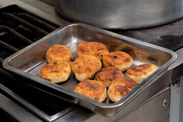 cooking fried pies with potatoes and cabbage in the dining room kitchen