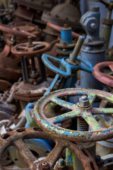 Industrial old valve caps vents of chemical production dismantled texture. Concept of modernization and updating of chemical plants for increasing efficiency and safety.