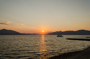 Fototapeta na wymiar Evia island, Greece - July 01. 2020: Sunset on the island of Evia, Greece.