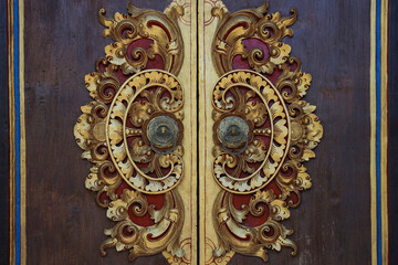 Old Wood Door With Bronze  Handle. Carving Wood Balinese style