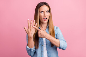 Photo of young pretty woman indicate finger questioned ring marriage isolated over pink color background