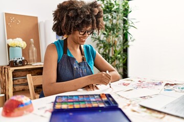 Young african american woman smiling confident having online draw class at art studio