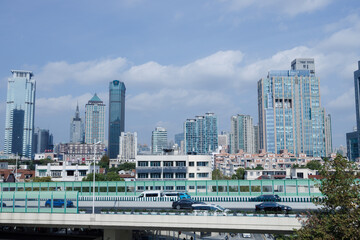 Naklejka premium Shanghai Skyline with blue sky and some white clouds 