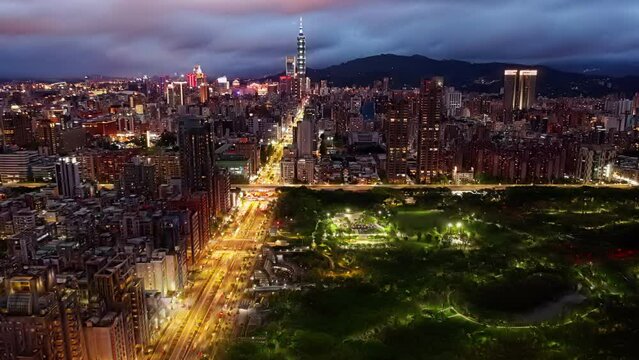 HYPERLAPAerial skyline of Taipei Downtown on a cloudy evening, with residential and office buildings next to Daan Forest Park, 101 Tower amid high-rise skyscrapers in background and busy traSE_0969_NW