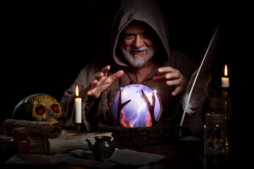 Old fortune teller with crystal ball