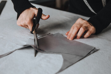 Tailor designer working of cutting piece of cloth with scissors, entrepreneur concept