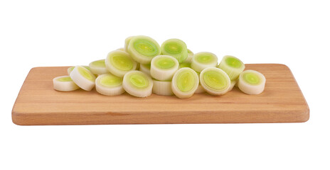 Natural fresh cut leek on wooden cutting board isolated on white background.