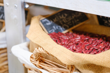 Wicker baskets with legumes in a store.