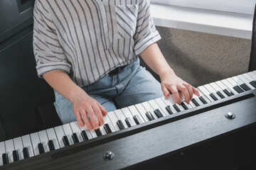 Music.girl plays  piano. Music background, creates music, a soundtrack. Business hobbies, relaxation and psychology. Education and remote work music making. AI-Generated Music
