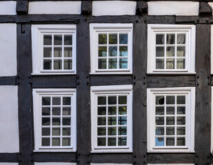 old half-timbered house facade with windows 