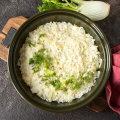 baking sheet with risotto with fennel and leek on the table