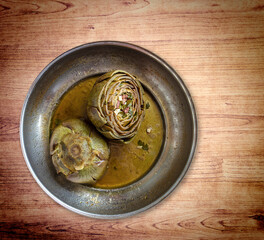 Stuffed artichoke with bacon, parsley and cheese